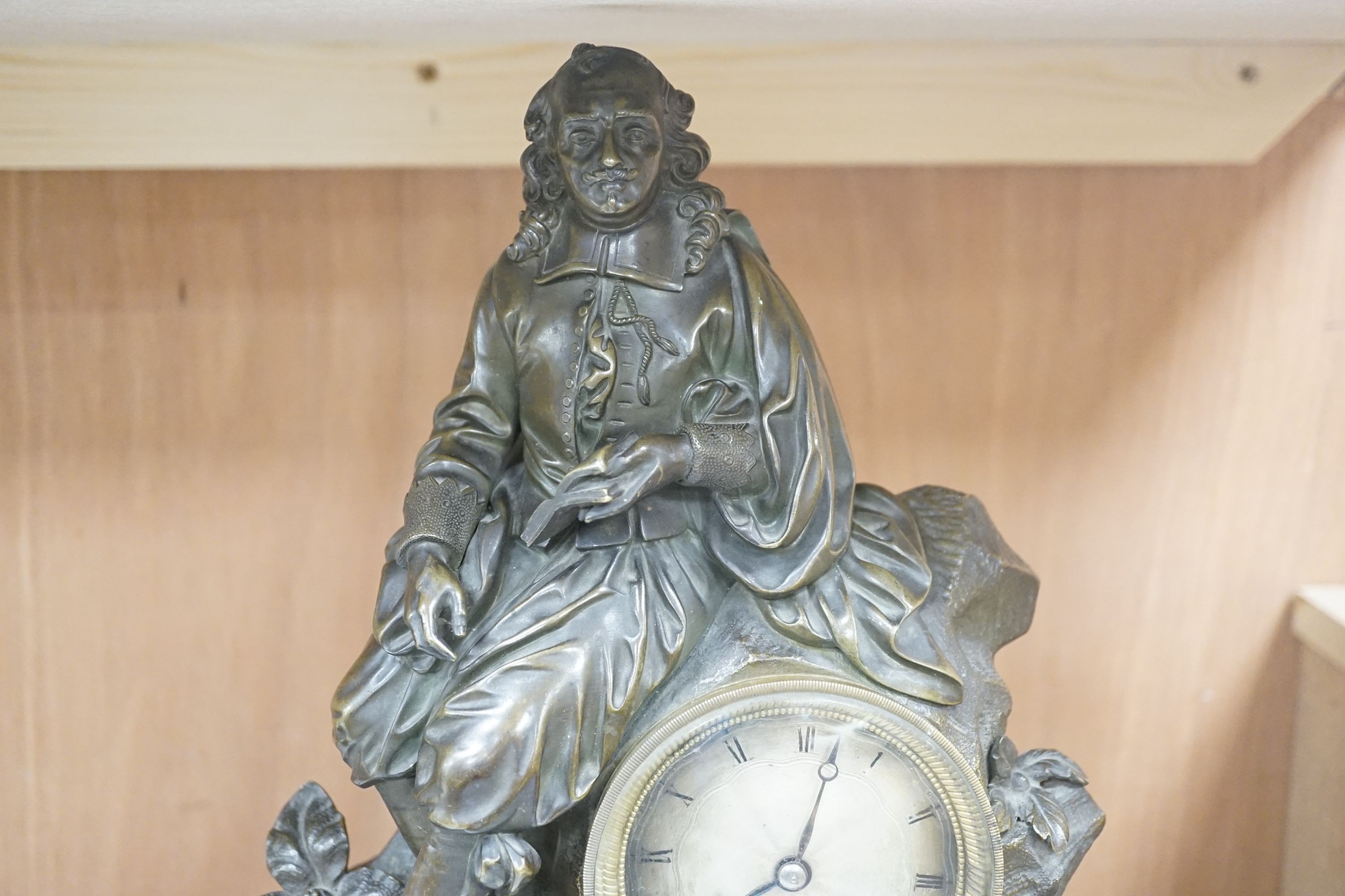 A 19th century French mantel clock, bronze scholar surmount, signed Bataille Aine, Besancon, 44cms high.